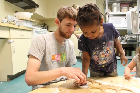 Kent and his helper work on cutting out the doughnut shapes.  Another friend worked on the holes. 
